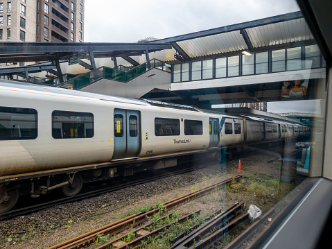 London. UK- 04.23.2023. A Thameslink railroad train pulling into East Croydon station.