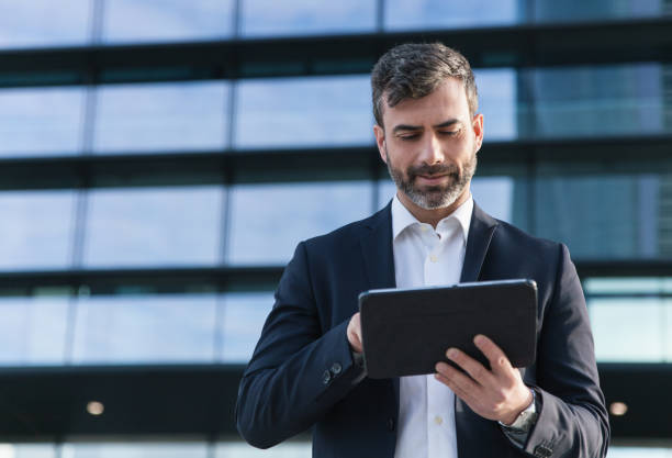 istock Businessman using tablet in financial district 1486491158
