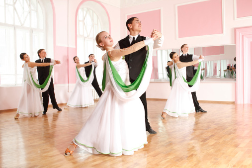 couple of  teenagers engaged in dancing the dance hall