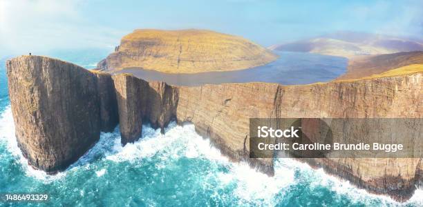 Two People On Top Of Slave Mountain Vágar Faroe Islands Stock Photo - Download Image Now