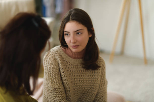 istock Teenage girl sharing problems with her mother. 1486495216