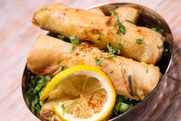 istock Deep Fried Vegetable spring roll with lime served in dish isolated on background top view of hot mezza 1486502546