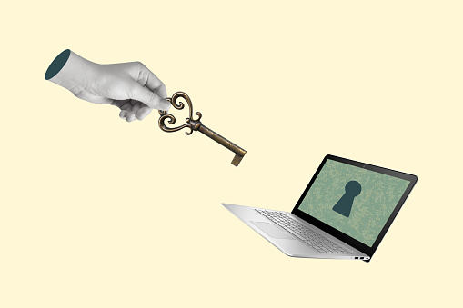 Creative collage of hand with a key and laptop. Computer protection from viruses and hacker attacks. Modern design. Copy space.