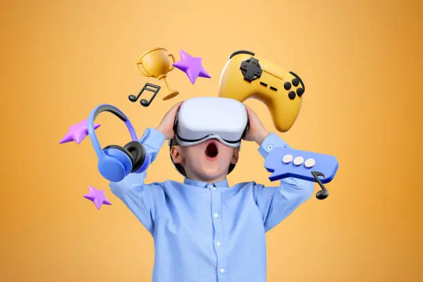 Astonished little boy in VR goggles standing over blue orange with videogames and multimedia icons above him. Concept of internet for joy