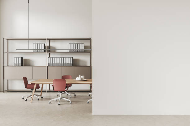 istock White modern business room interior with meeting table and shelf. Mockup wall 1486508705