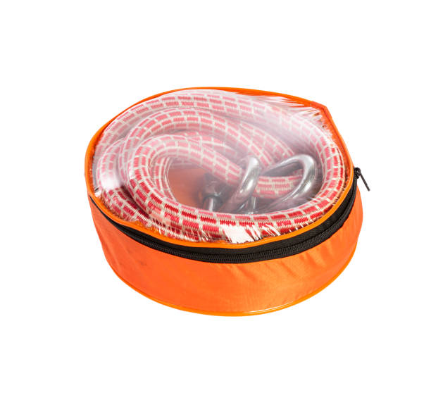 istock Orange car tow rope in a soft bag for transportation isolated on white background 1486518459