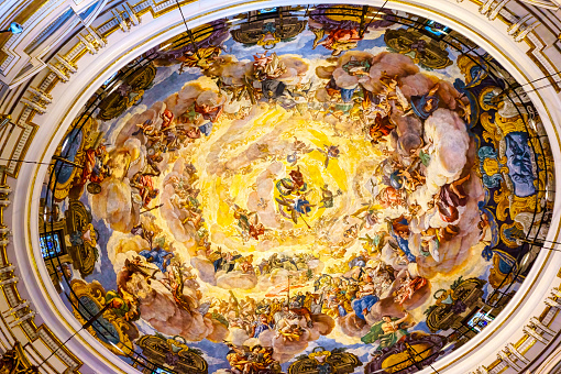 Valencia, Spain - April 8, 2023: Looking up at the painted ceiling inside the Church of Our Lady of the Forsaken cupola. There are no people on the scene.