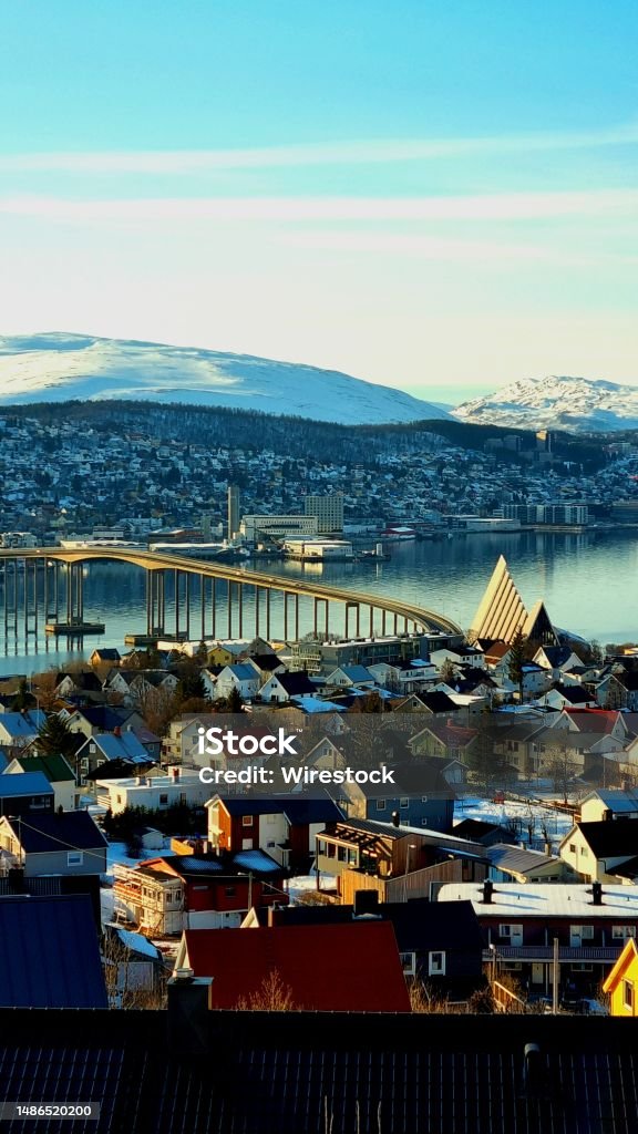 Scenic view of the Tromso and the arctic cathedral in Norway from the top of a hill A scenic view of the Tromso and the arctic cathedral in Norway from the top of a hill Tromso Stock Photo