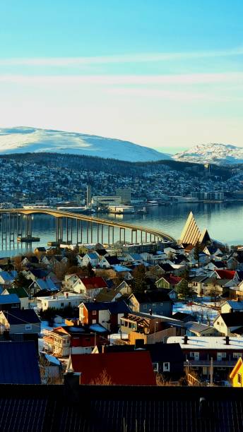 Scenic view of the Tromso and the arctic cathedral in Norway from the top of a hill A scenic view of the Tromso and the arctic cathedral in Norway from the top of a hill tromso stock pictures, royalty-free photos & images