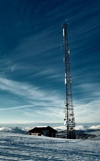 istock a radio tower in a snow covered field under a blue sky 1486520201
