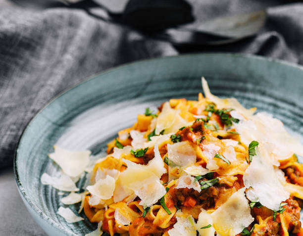 Tagliatelle with ragu bolognese sauce with parmesan stock photo