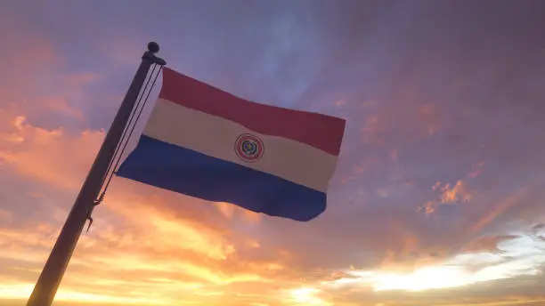 Photo of Paraguay Flag on Flagpole by Evening Sunset / Sunrise Sky