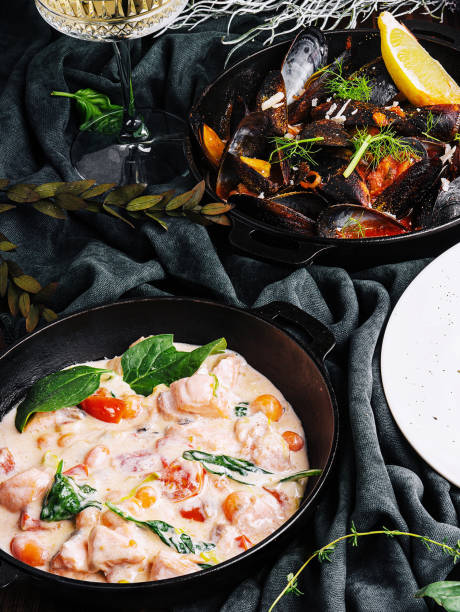 Salmon in cream sauce and Mussels stock photo
