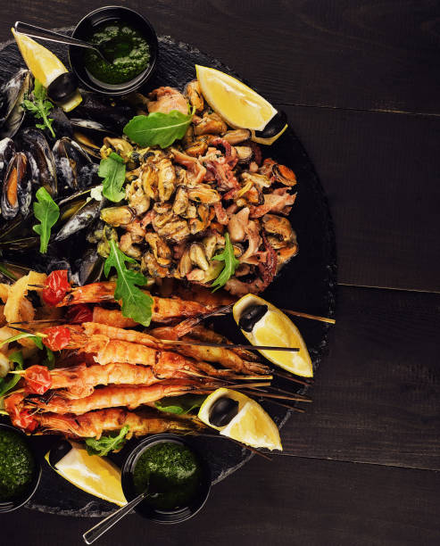 istock fried shrimp, squid rings, mussels, octopus and pesto sauce 1486525158