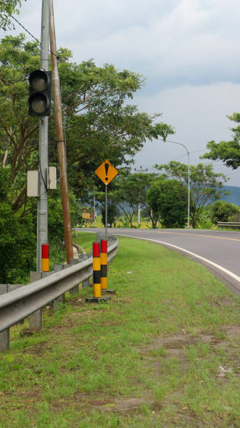 istock Road markings at sharp turns. Traffic signs. 1486525944