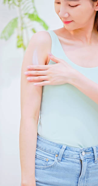 istock girl applying lotion on arm 1486527139