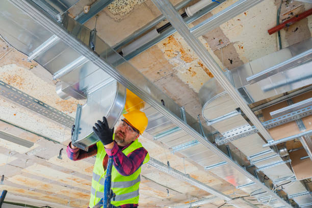 istock Manual Worker installing air conditioner in building. 1486530077