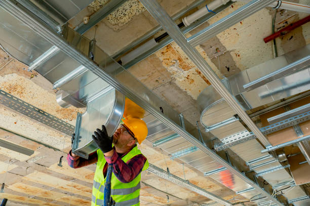 manual worker installing air conditioner in building. - air duct imagens e fotografias de stock