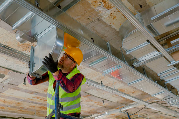 istock Manual Worker installing air conditioner in building. 1486531673
