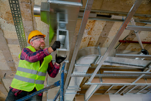 istock Manual Worker installing air conditioner in building. 1486531865
