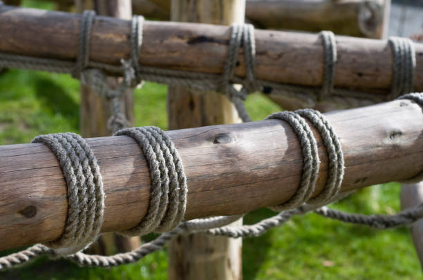 Closeup Image Of Bamboo Fence Tied With Ropes Stock Photo