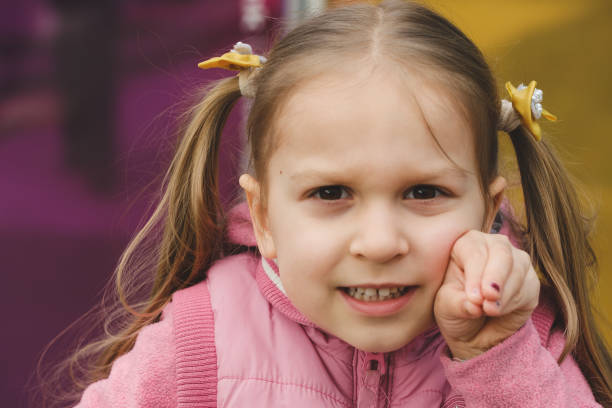 istock Child looking curious and exited over colored background 1486536050