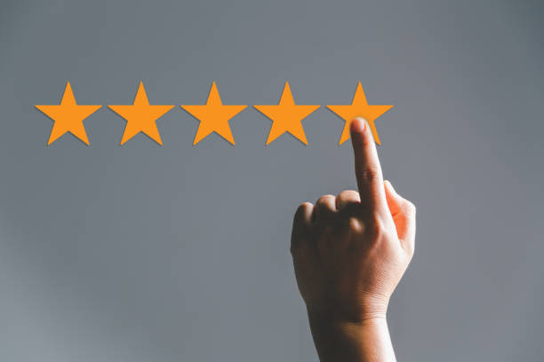istock Customer experience with customer service and satisfaction concept. Woman finger touching on five star excellent rating on background, copy space, Customers show satisfaction and quality of services. 1486536792