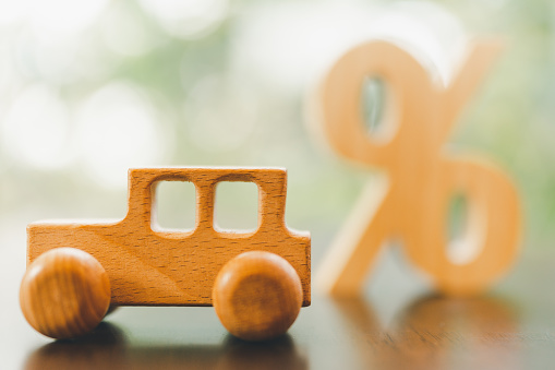 Wooden car model, Percentage symbol with sunlight, Concepts of interest, a symbol for buying a new car, vehicle car auto repair service maintenance.