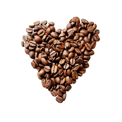 I love coffee. Cup with coffee beans with heart on wooden background.