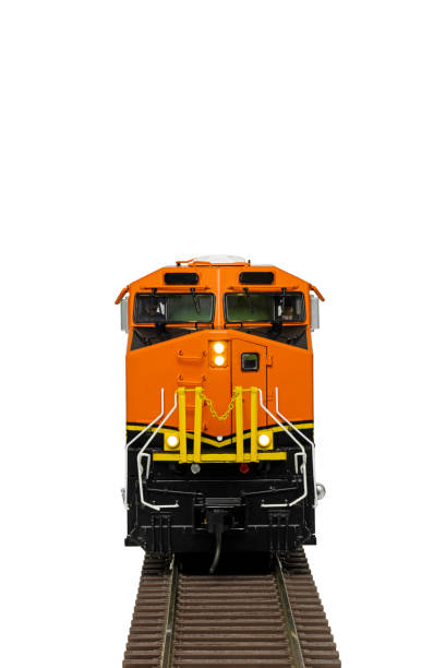 A orange and black diesel train locomotive on railroad track.
