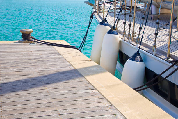 istock Bumpers protection between two moored boats in a small harbour 1486553087