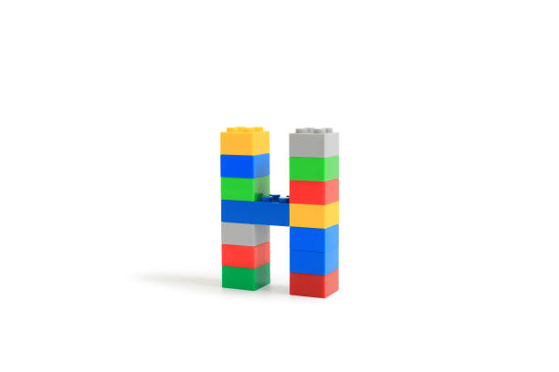istock Alphabet letters H from colorful plastic brick block constructor isolated on white background. Image with Clipping path 1486554170