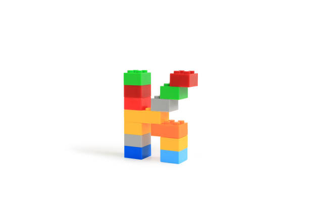 istock Alphabet letters K from colorful plastic brick block constructor isolated on white background. Image with Clipping path 1486554183