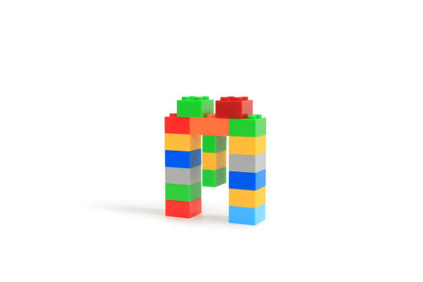 istock Alphabet letters M from colorful plastic brick block constructor isolated on white background. Image with Clipping path 1486554190