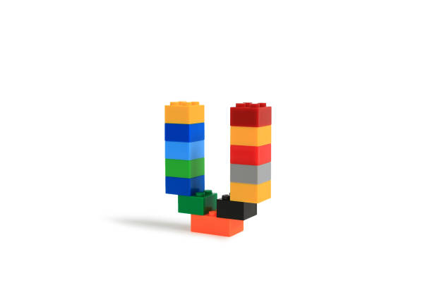 istock Alphabet letters U from colorful plastic brick block constructor isolated on white background. Image with Clipping path 1486554210