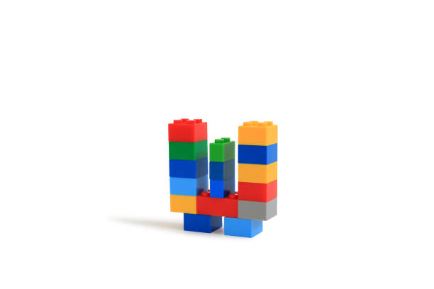 istock Alphabet letters W from colorful plastic brick block constructor isolated on white background. Image with Clipping path 1486554223