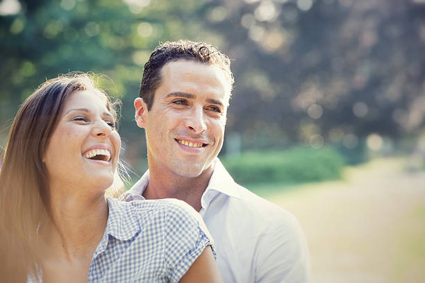 istock young couple having fun at the park 148655620