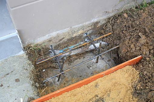 Foundation or base of house with reinforced concrete, metal rods for strength a civil engineering. Concrete footing.