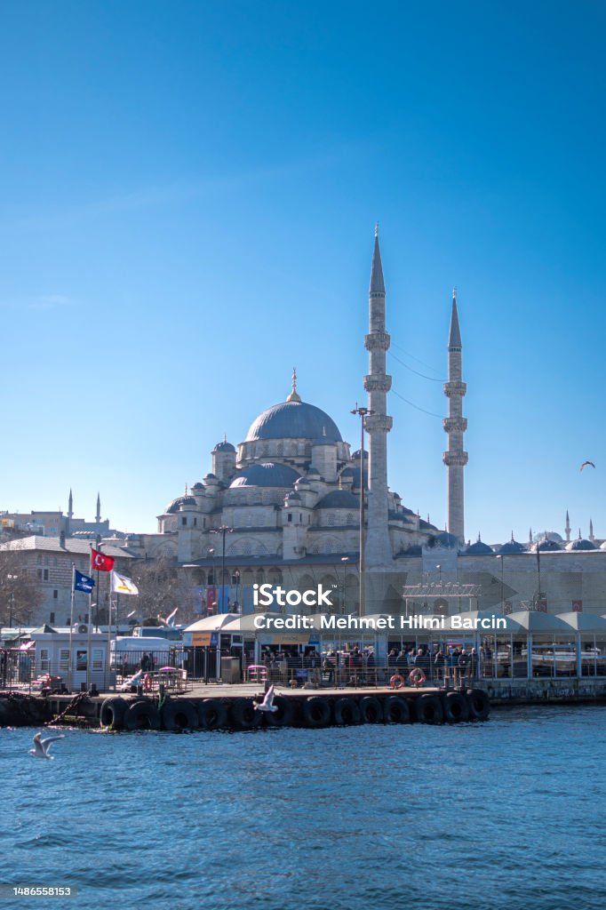 Yeni Cami Mosque in sunny day, Istanbul, Turkey Istanbul, Turkey : January 09, 2023: Yeni Cami Mosque in sunny day, Istanbul, Turkey Beauty In Nature Stock Photo