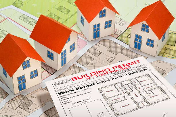 istock New home and free vacant land for building activity - Construction industry and building permit concept with a residential area, cadastral map, General Urban Planning and zoning regulations 1486559755