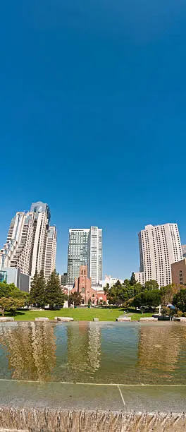 Photo of Summer in the city towers and skyscrapers reflected San Francisco