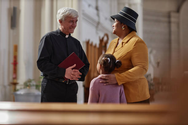 istock Priest discussing ceremony with people 1486567473