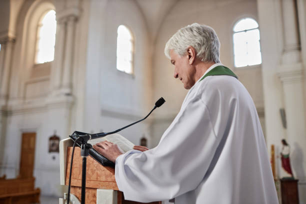 istock Priest reading sermon at ceremony in church 1486567478