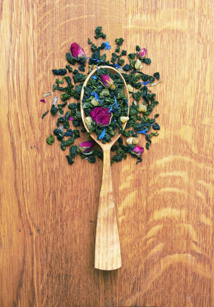 istock Tea in a wooden spoon on a wood 1486569065
