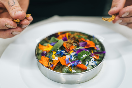 A dish covered in edible flowers