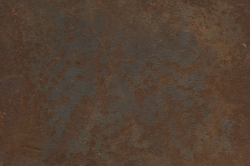 Rust makes an interesting pattern on a light painted metal surface