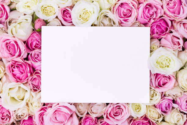 istock Paper card mockup on romantic roses background with copy space 1486575558