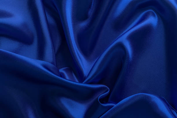 istock Blue atlas material background, silk abstract drapery cloth 1486575591
