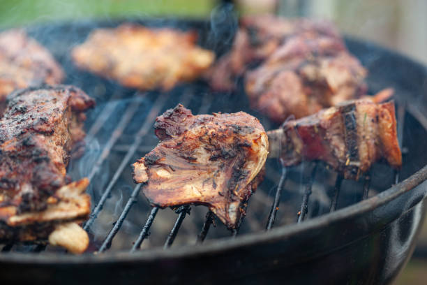istock Cooking different meat on barbecue. Grilled and roasted lamb steaks on bbq 1486576223
