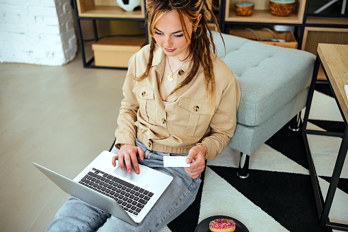 Beautiful woman using laptop for online shopping